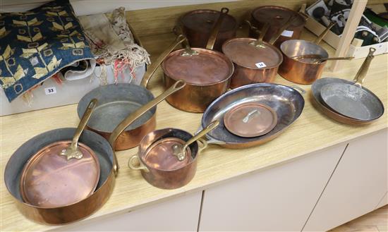 A collection of 11 assorted copper pans